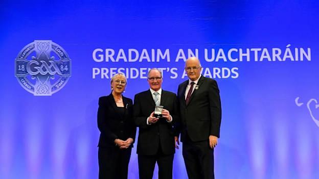 Con Ó Dónaill of Bun an Phobail, Dún na nGall, is presented with the Gradaim Gaeilge by Maolmhuire Tynan, Head of Public Affairs AIB, and Uachtarán Chumann Lúthchleas Gael John Horan during the GAA President’s Awards at Croke Park in Dublin.