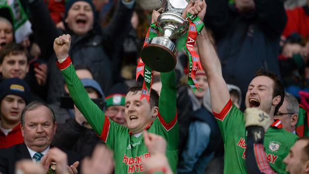 St Brigid's joint captains Gearóid Cunniffe, left, and Darragh Donnelly lift the Andy Merrigan cup. 