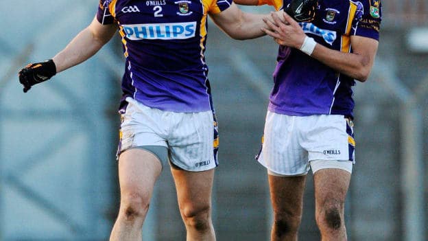 Craig Dias, right, Kilmacud Crokes, tries to console team-mate Ross O'Carroll after the 2011 AIB All-Ireland SFC semi-final defeat to Crossmaglen Rangers. 