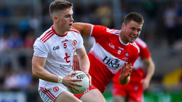Conall Grimes, Tyrone, and Ruairi Gormley, Derry, during the EirGrid Ulster Under 20 Final at the Athletic Grounds.