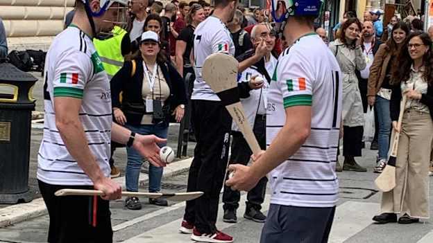Players from Milan and Lazio GAA clubs demonstrate the skills of hurling before a crowd of interested onlookers in Perugia. 