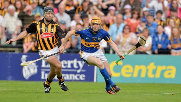 Kilkenny's JJ Delaney keeps a close eye on Tipperary's Lar Corbett during their 2013 All-Ireland SHC Qualifier clash at Nowlan Park. 