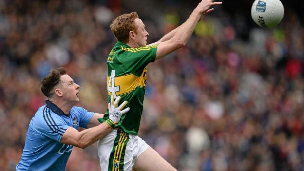 Philly McMahon tussles with Colm Cooper.