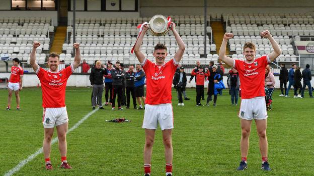 Athy captain David Hyland, centre, and his team-mates Niall Kelly, left, and Kevin Feely celebrate with the Dermot Bourke cup after the Kildare County Senior Football Championship Final match between Moorefield and Athy at St Conleth's Park in Newbridge, Kildare. 