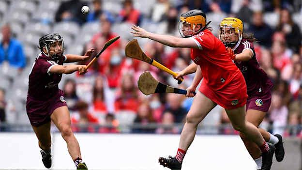 Cork goalkeeper Amy Lee gets a pass away despite the efforts of Niamh Kilkenny, left, and Siobhán McGrath of Galway during the 2021 All-Ireland Senior Camogie Championship Final match between Cork and Galway at Croke Park in Dublin. 