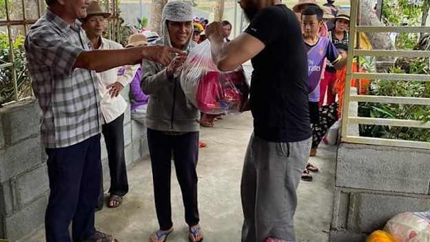 Vietnamese displaced by diastrous flooding in 2020 receiving aid donated by the GAA clubs of Vietnam. 