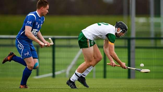 Donal Burke, Ireland, and Craig Ritchie, Scotland, in action during the Under 21 Hurling-Shinty International at the Games Development Centre in Abbotstown.
