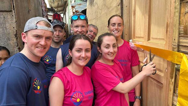 Volunteers from Kildalkey and Boardsmill GAA clubs prepare to cut the ribbon on the school they build for the Badjao tribe in Davao, The Philippines. 