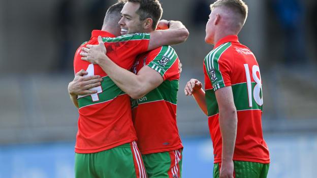 Ballymun Kickhams players, from left, Fiach Andrews, Dean Rock, and Ciarán McManus celebrate after the Dublin County Senior 1 Football Championship Final match between Ballyboden St Enda's and Ballymun Kickhams at Parnell Park in Dublin. 