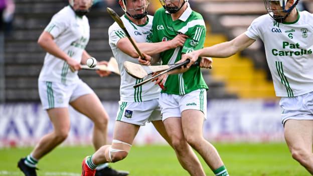 Mikey Butler of O'Loughlin Gaels challenges Tullaroan's John Walton in the 2021 Leinster SHC Hurling semi-final. 