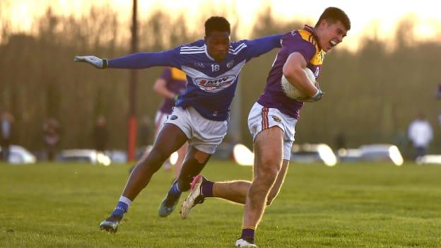 Eoin Porter of Wexford in action against Collins Ugochukwu of Laois during the O'Byrne Cup group B match between Wexford and Laois at Hollymount in Galbally, Wexford.