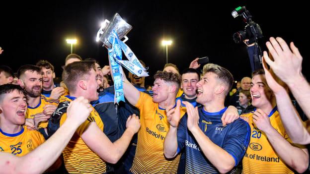 Conor Morrison, centre, and Evan Comerford celebrate with team-mates following DCU Dóchas Éireann's victory over Carlow IT in the Electric Ireland Sigerson Cup Final. 
