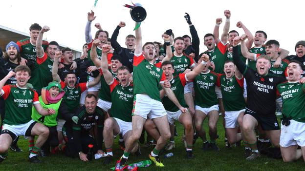 St. Brigid's joint-captain Paul McGrath lifts the Shane McGettigan cup as he celebrates with team-mates after their side's victory over Corofin at Dr. Hyde Park this afternoon. 