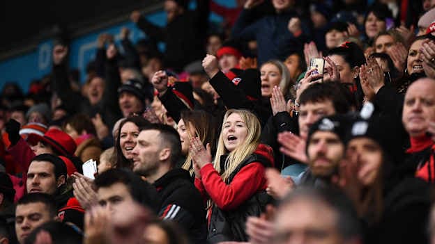 Supporters react during the AIB GAA Hurling All-Ireland Senior Club Championship Semi-Final match between Ballygunner, Waterford, and Slaughtneil, Derry, at Parnell Park in Dublin.