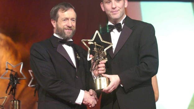 Ken McGrath is presented with his 2004 Vodafone All-Star award by Iar-Uachtarán Sean Kelly. 
