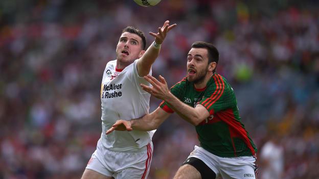 Connor McAliskey and Kevin McLoughlin tussle for possession at Croke Park.