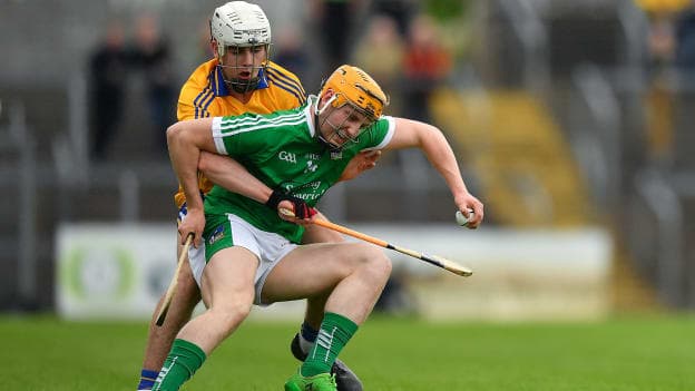 Seamus Flanagan, Limerick, and Ross Hayes, Clare, in action at Cusack Park, Ennis.