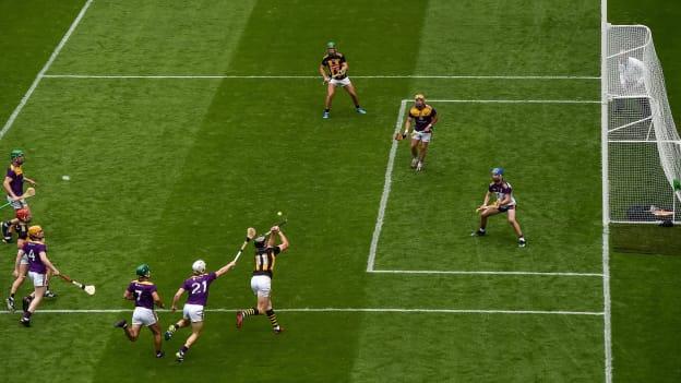 Walter Walsh of Kilkenny shoots to score his side's second goal, past Wexford goalkeeper Mark Fanning, during the Leinster GAA Hurling Senior Championship Semi-Final match between Kilkenny and Wexford at Croke Park in Dublin. 