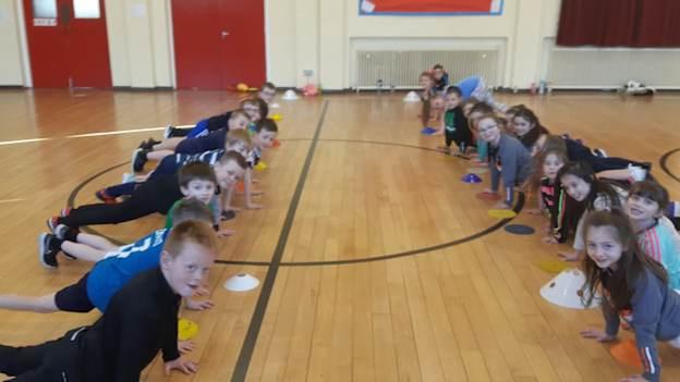 Pupils at Armagh CBS Primary School being put through their paces by Ulster GAA coach Kevin Curran. 