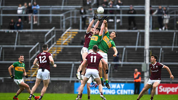 Damien Comer of Galway contests a kick out with Mark Plunkett and Shane Moran of Leitrim during the 2022 Connacht GAA Football Senior Championship Semi-Final match between Galway and Leitrim at Pearse Stadium in Galway. 