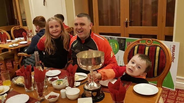 Carrick Hurling Club manager, Olcan Conway, celebrates with the Cup after their Connacht Junior Hurling Final victory. 