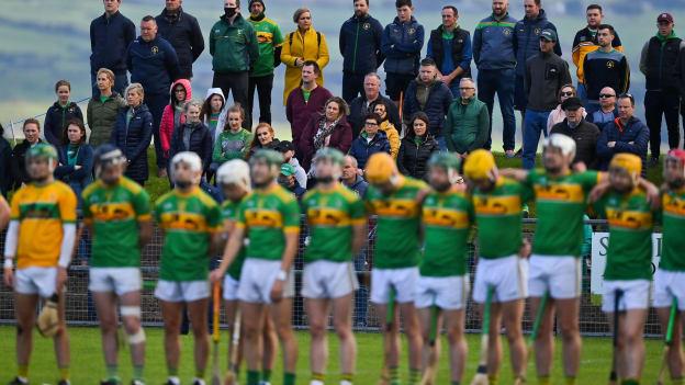Dunloy supporters stand behind their team for Amhrán na bhFiann prior to the Antrim County Senior Hurling Championship Final match between Dunloy Cuchullains and Loughgiel Shamrocks at Páirc Mhic Uilín in Ballycastle, Antrim.