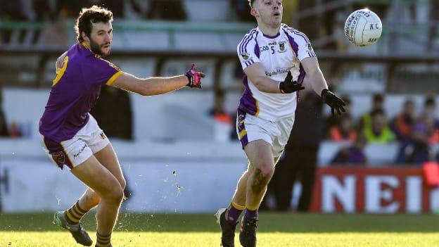 Dan O'Brien, Kilmacud Crokes, and Alan Callaghan, Wolfe Tones, during the AIB Leinster Club SFC Quarter-Final at Páirc Tailteann.