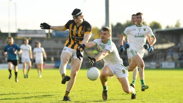 Caolan Finnegan of Crossmaglen Rangers shoots to score his side's first goal despite the attention of Odhran Doyle of Granemore during the Armagh County Senior Club Football Championship Final match between Crossmaglen Rangers and Granemore at Athletic Grounds in Armagh. 
