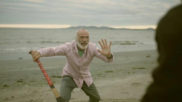Kila lead singer, Rónán Ó Snodaigh, and former Wexford hurler, Diarmuid Lyng, pictured shooting the video for the song, 'Calling All Angels', on Dublin's Shelley Bank Beach. Photograph by Myles O'Reilly. 