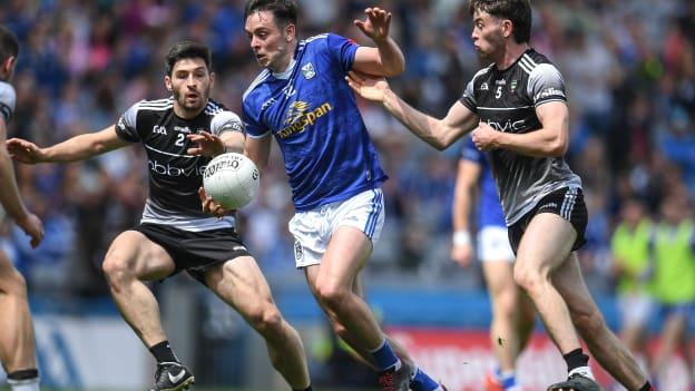 Gerard Smith, Cavan in Tailteann Cup action against Sligo's Nathan Mullen and Luke Towey.