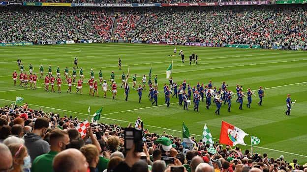 The Cork and Limerick hurling teams march behind the Artane Band before the 2021 All-Ireland SHC Final. 