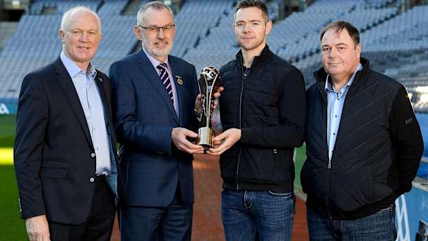 GAA President, Larry McCarthy, presents the Dermot Earley Family award to the Rock family, left to right, Barney, Dean, and Joe. 