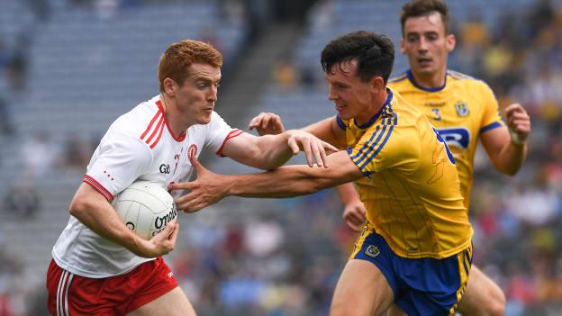 Peter Harte and Tadhg O'Rourke collide at Croke Park.