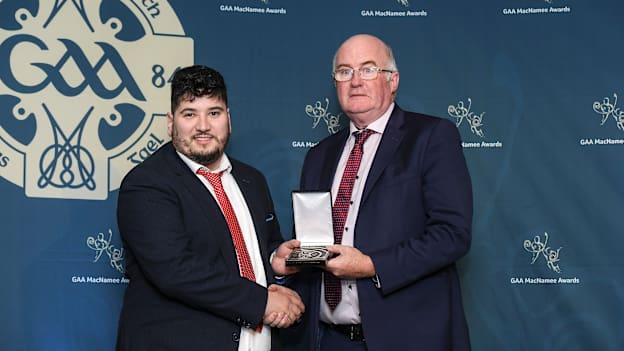 Iar-Uachtarán Chumann Lúthchleas Gael John Horan presents the MacNamee Awards for Best GAA Website for 2020 to Shane Jordan PRO of Blarney GAA Club.