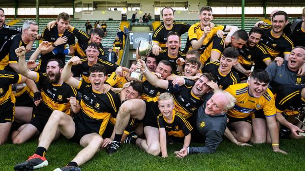 Dr. Crokes players celebrate after winning the 2020 Kerry Intermediate Hurling Championship. 
