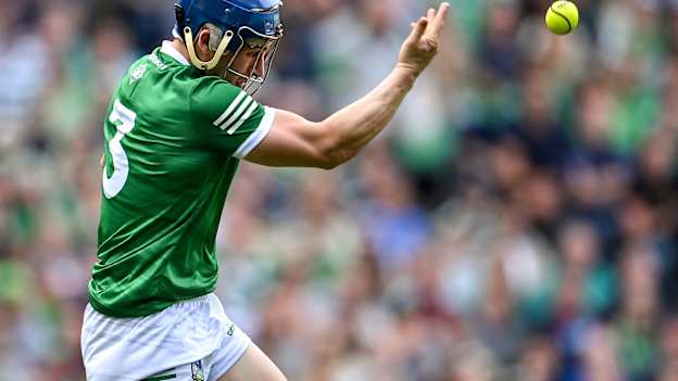 Mike Casey of Limerick makes a handpass during the 2022 GAA Hurling All-Ireland Senior Championship Semi-Final match between Limerick and Galway at Croke Park in Dublin. 