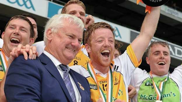Captain Jody Harkin of Middle East lifts the trophy alongside Uachtarán Chumann Lúthchleas Gael Aogán Ó Fearghail following his side's victory in the GAA World Games Huring Cup (Irish) Final during Day 4 of the GAA World Games 2016 at Croke Park in Dublin.