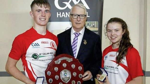 Antoin Fox and his sister Mairéad their 2016 All-Ireland 60x30 Championship medals from GAA Handball president Willie Roche. The Fox siblings won five major national titles each in 2016.