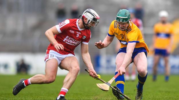 Patrick Crotty, Clare, and Timmy Wilk, Cork, in oneills.com Munster U20 Hurling Championship action at Cusack Park. Photo by John Sheridan/Sportsfile