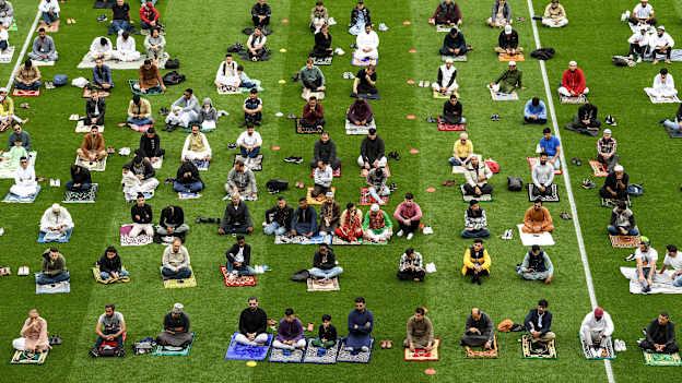 Muslim worshipers join Shaykh Dr Umar Al-Qadri as they offer Eid al-Adha prayers on the pitch in Croke Park during the celebration of Eid Al-Adha at Croke Park last year. Photo by Ray McManus/Sportsfile