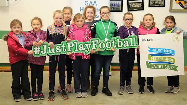 Aoidhinn O'Brien pictured with her medal and surrounded by friends after winning an award for her contribution to the #JustPlayFootball campaign.