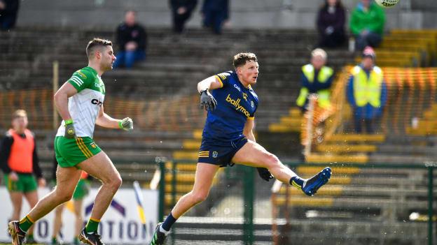Conor Cox of Roscommon scores a point despite the efforts of Brendan McCole of Donegal during the Allianz Football League Division 1 match between Roscommon and Donegal at Dr Hyde Park in Roscommon. 