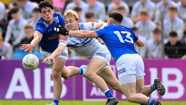 Sean Greene of Laois in action against Oisin Brady, left, and Ryan O'Neill of Cavan during the Tailteann Cup between Cavan and Laois at Kingspan Breffni in Cavan. 