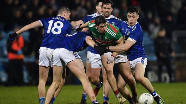 Lee Keegan of Mayo in action against Cavan's Stephen Murray, Paul Graham and Dara McVeety during the Allianz Football League Division 1 Round 3 match between Mayo and Cavan at Elverys MacHale Park in Castlebar, Mayo. 