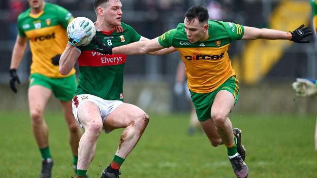 Mattie Ruane, Mayo, and Caolan McColgan, Donegal, in Allianz Football League action. Photo by Ramsey Cardy/Sportsfile