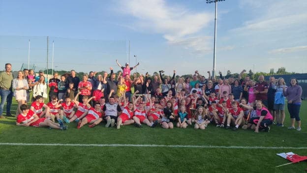 Derry players celebrate their victory with supporters, coaches and family members at Abbotstown. 