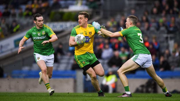 Donegal midfielder Hugh McFadden being tackled by Meath's Cillian O'Sullivan and Conor McGill at Croke Park during the Allianz Football League Division Two Final at Croke Park.