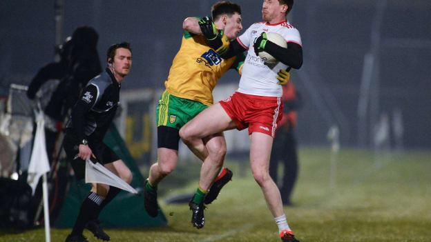 Jamie Brennan, Donegal, and Colm Cavanagh, Tyrone, collide during the Allianz Football League.
