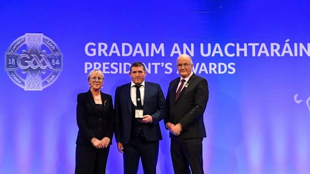 Nick Fitzgerald of Kildalkey GAA, Meath, is presented with the Leinster award by Maolmhuire Tynan, Head of Public Affairs AIB, and Uachtarán Chumann Lúthchleas Gael John Horan during the GAA President’s Awards at Croke Park in Dublin.