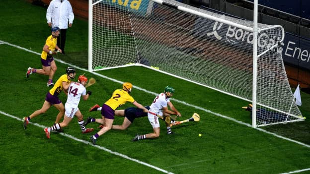 Brian Concannon of Galway scores his side's first goal, despite the challenge of Simon Donohoe, left, and Mark Fanning of Wexford during the Leinster GAA Hurling Senior Championship Semi-Final match between Galway and Wexford at Croke Park in Dublin.